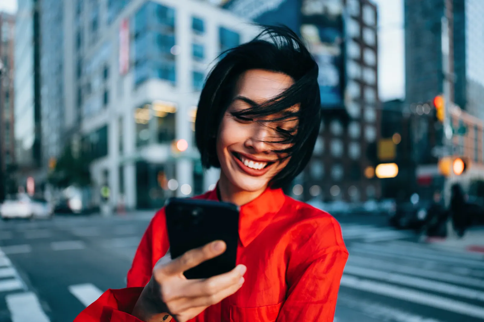 Person using a mobile phone for social media marketing